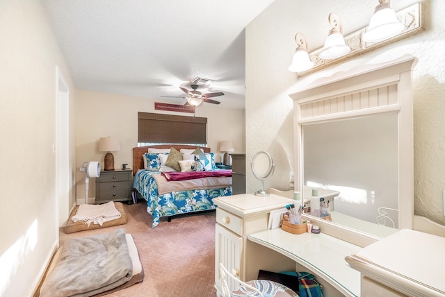 bedroom featuring carpet, a textured ceiling, and ceiling fan