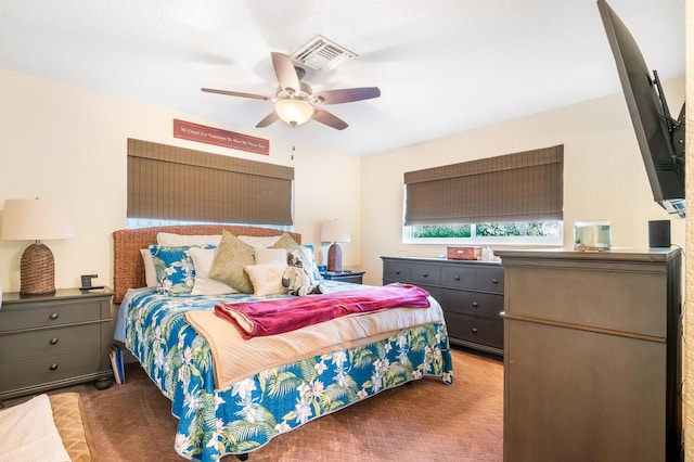 carpeted bedroom featuring ceiling fan