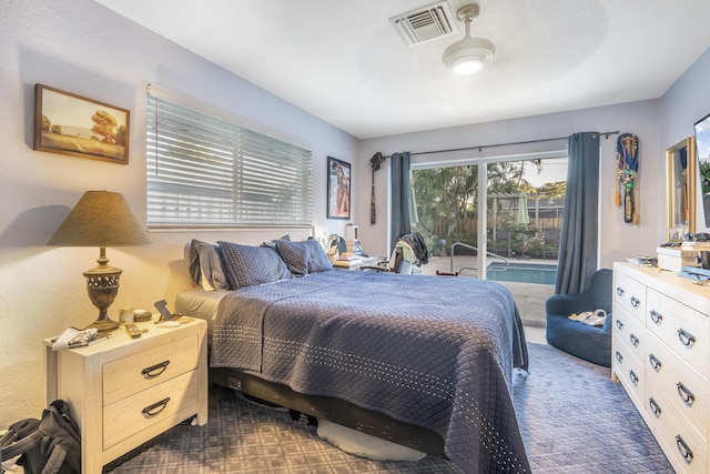 bedroom featuring dark colored carpet and ceiling fan