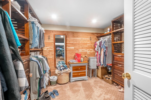 walk in closet with carpet flooring