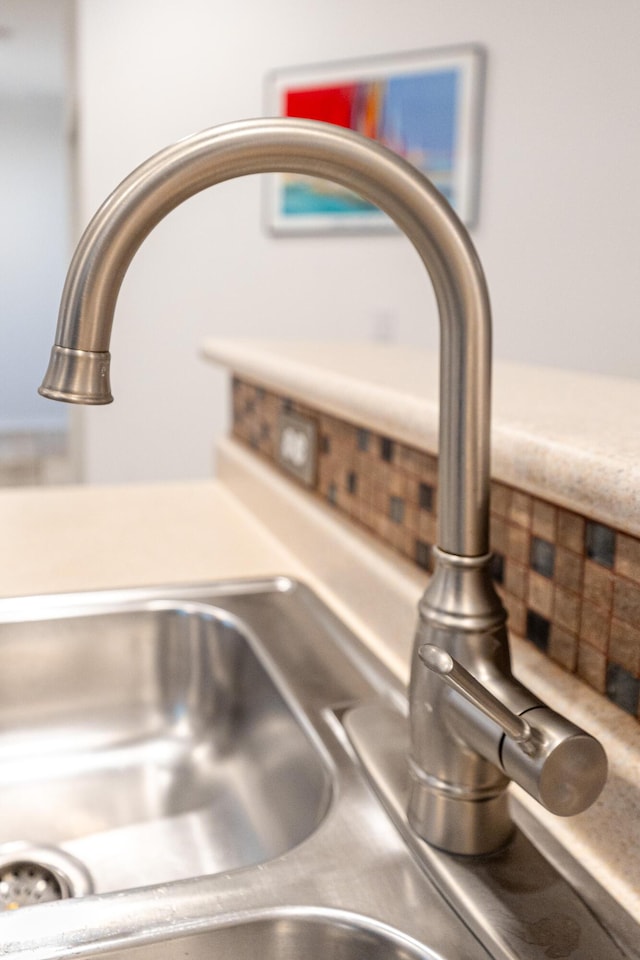 room details featuring light countertops and a sink