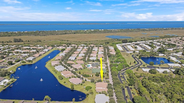 aerial view featuring a residential view and a water view