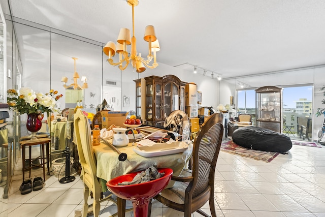 tiled dining space with a notable chandelier