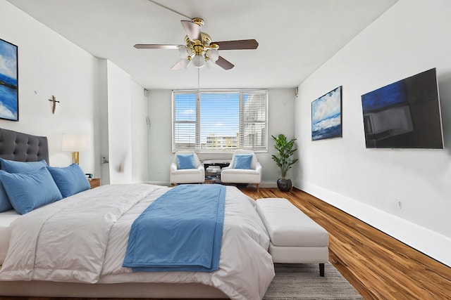 bedroom with hardwood / wood-style flooring and ceiling fan