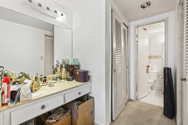 bathroom with vanity and toilet