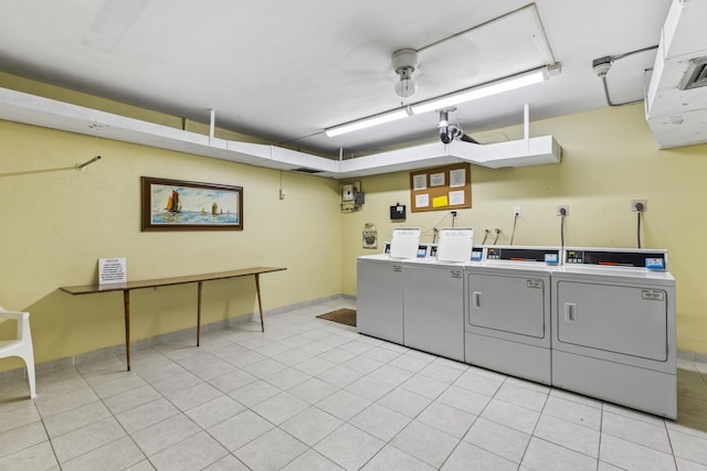 washroom with washer and dryer and light tile patterned floors