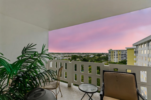 view of balcony at dusk