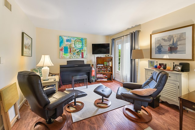 sitting room featuring light hardwood / wood-style floors