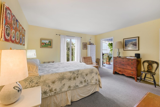 carpeted bedroom featuring access to outside