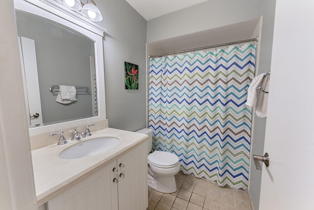 bathroom with tile patterned floors, vanity, a shower with shower curtain, and toilet