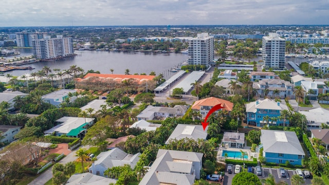 birds eye view of property with a water view