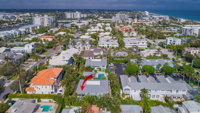 birds eye view of property with a water view