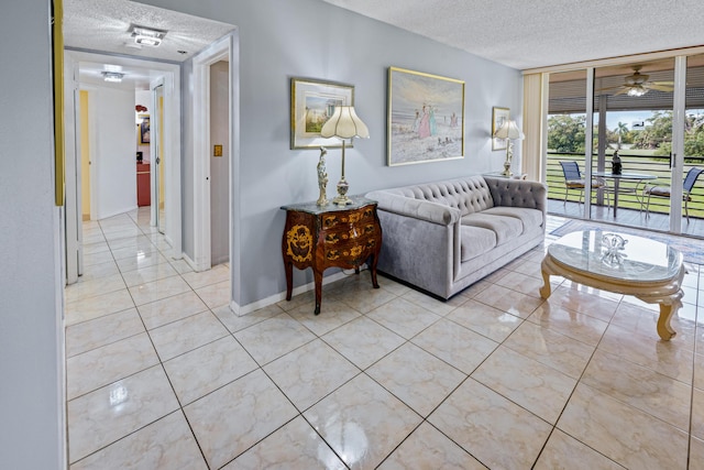 living room featuring light tile patterned floors and a textured ceiling