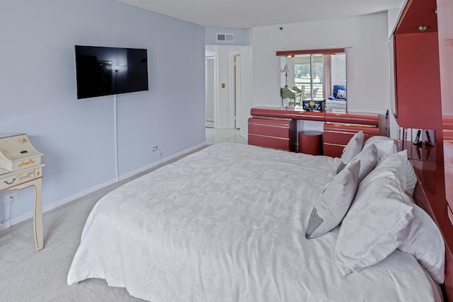 bedroom featuring light carpet