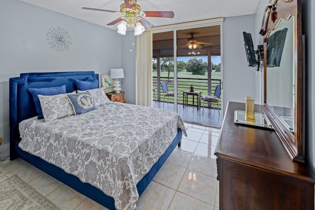 bedroom featuring access to exterior, light tile patterned floors, a textured ceiling, and ceiling fan