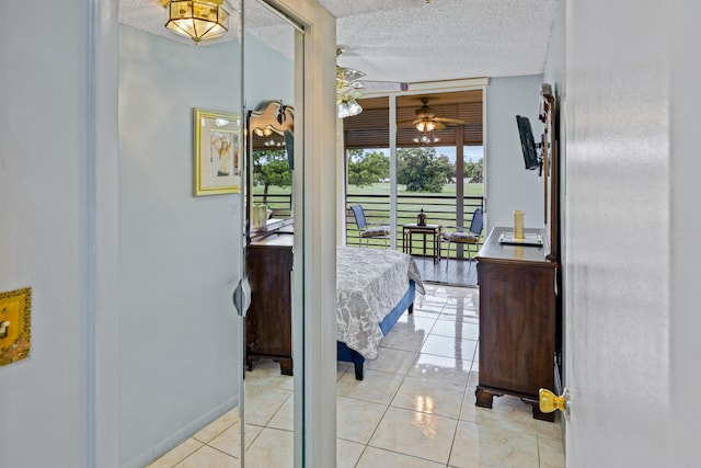 tiled bedroom with a textured ceiling