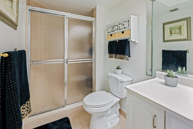 bathroom featuring tile patterned floors, an enclosed shower, and toilet