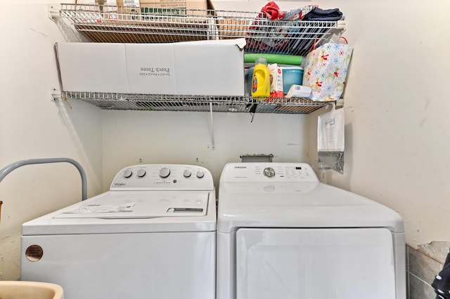 washroom with independent washer and dryer