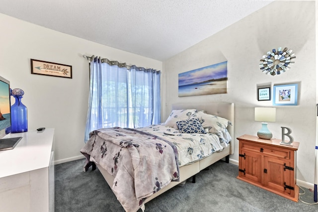 bedroom with carpet flooring, a textured ceiling, and vaulted ceiling