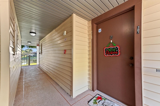 doorway to property featuring a water view