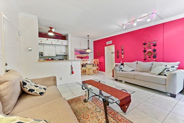 tiled living room with crown molding, track lighting, a textured ceiling, and ceiling fan