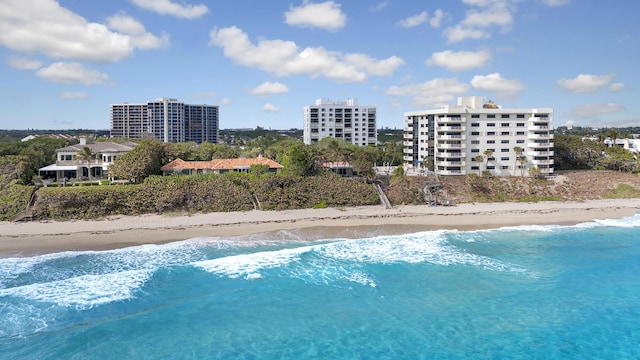 aerial view featuring a view of the beach and a water view