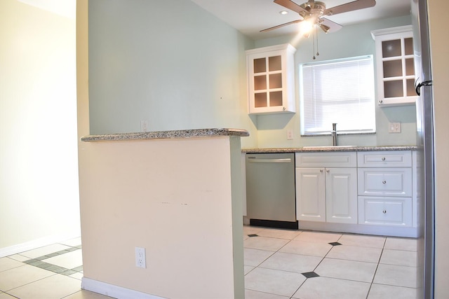 kitchen with ceiling fan, sink, light tile patterned floors, white cabinets, and appliances with stainless steel finishes