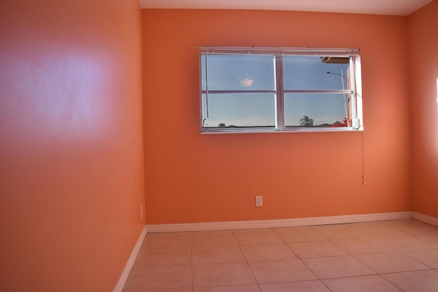 unfurnished room featuring light tile patterned floors