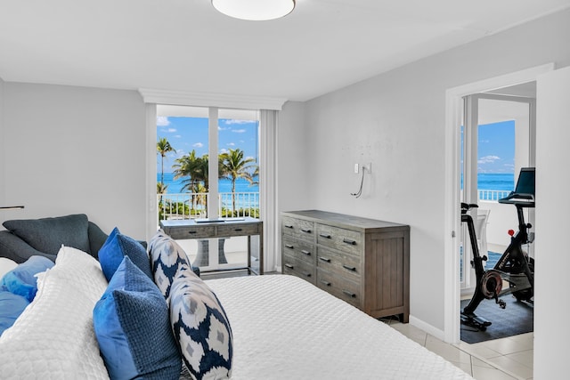 tiled bedroom with a water view