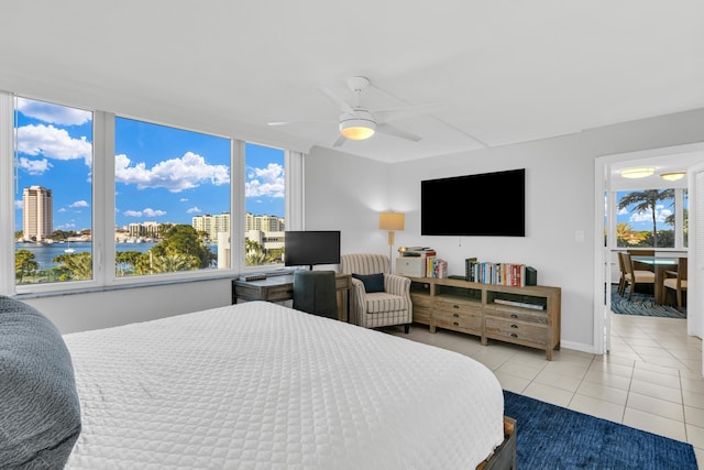 tiled bedroom with ceiling fan