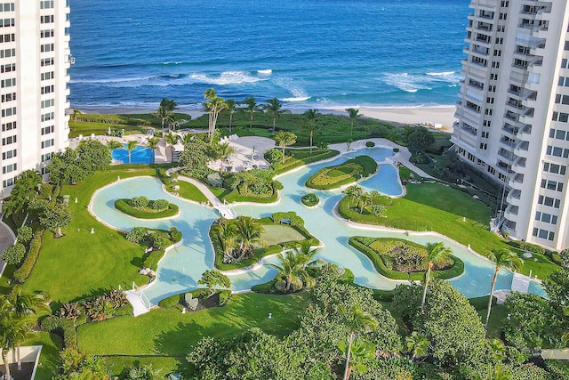 aerial view with a water view and a beach view