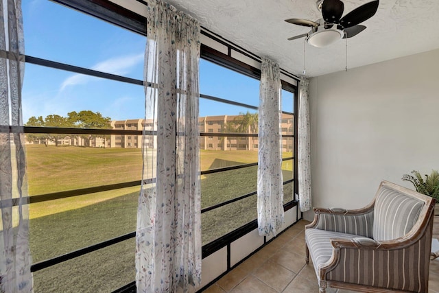 sunroom / solarium with ceiling fan