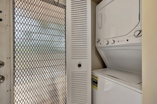 laundry area featuring stacked washing maching and dryer