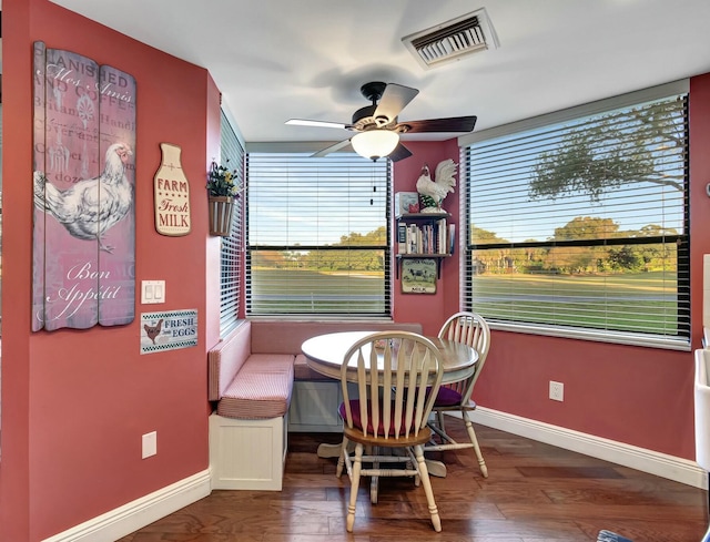 dining area with ceiling fan, hardwood / wood-style floors, and breakfast area