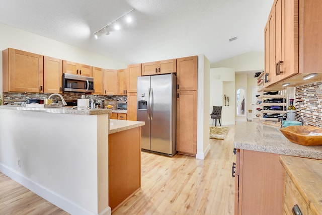 7708 Cherry Blossom Way, Boynton Beach, FL 33437 - kitchen with stainless steel appliances, light wood-type flooring, backsplash, vaulted ceiling, and rail lighting