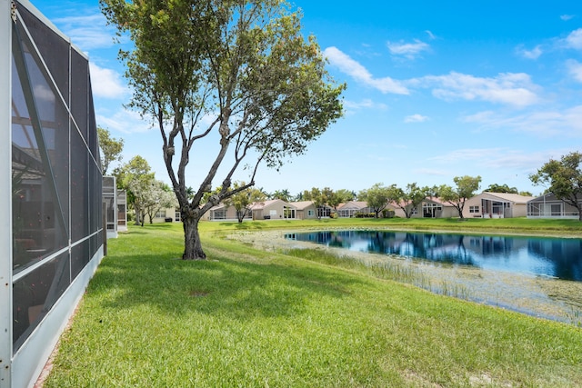 7708 Cherry Blossom Way, Boynton Beach, FL 33437 - view of green lawn with a water view, a residential view, and a lanai