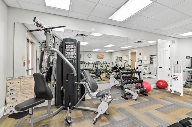 7708 Cherry Blossom Way, Boynton Beach, FL 33437 - exercise room with a paneled ceiling and carpet