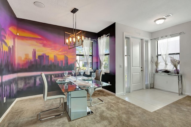 carpeted dining room featuring a textured ceiling and an inviting chandelier