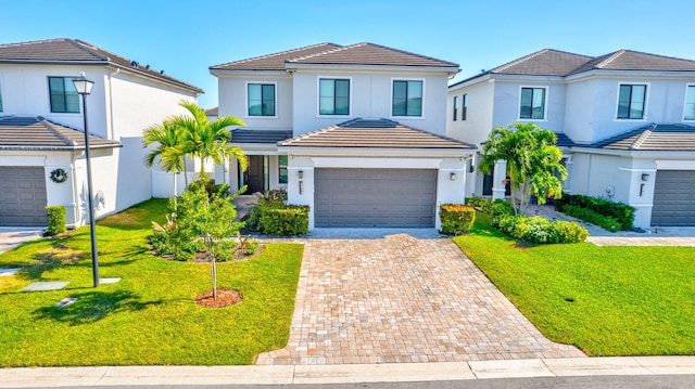 view of front property with a front yard and a garage