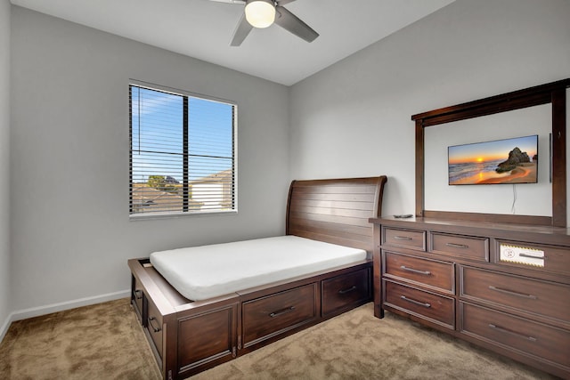 carpeted bedroom with ceiling fan and lofted ceiling