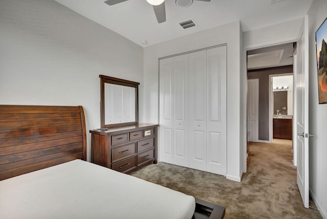 bedroom with ceiling fan, carpet floors, and a closet