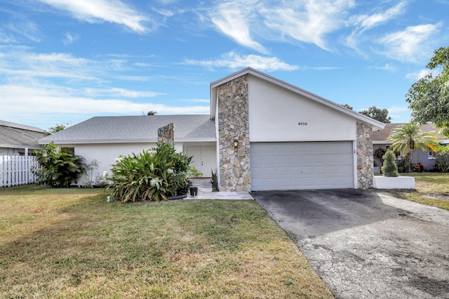 view of front of home featuring a garage and a front lawn