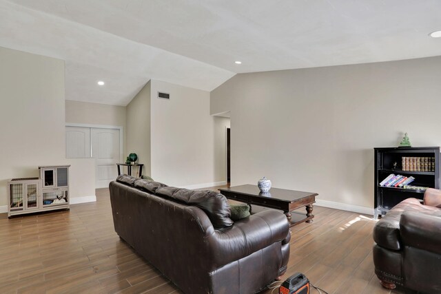 living room with lofted ceiling