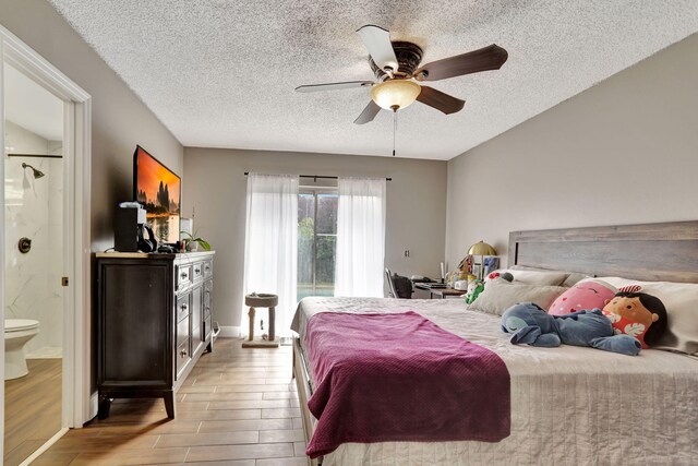 bedroom with a textured ceiling, dark hardwood / wood-style floors, and ceiling fan