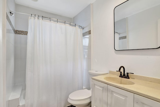 bathroom featuring vanity, toilet, and a shower with shower curtain