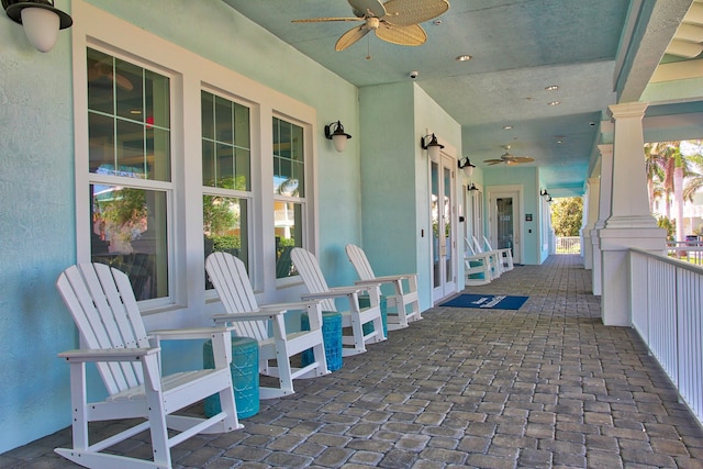 view of patio featuring ceiling fan and a porch