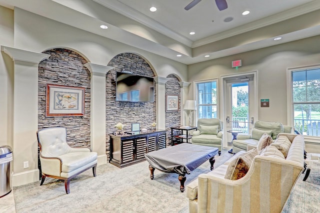 living room featuring ornamental molding and ceiling fan