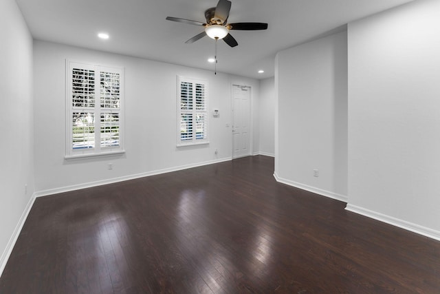 empty room featuring dark hardwood / wood-style floors and ceiling fan