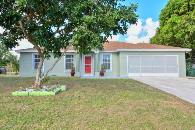 ranch-style home with a front lawn and a garage