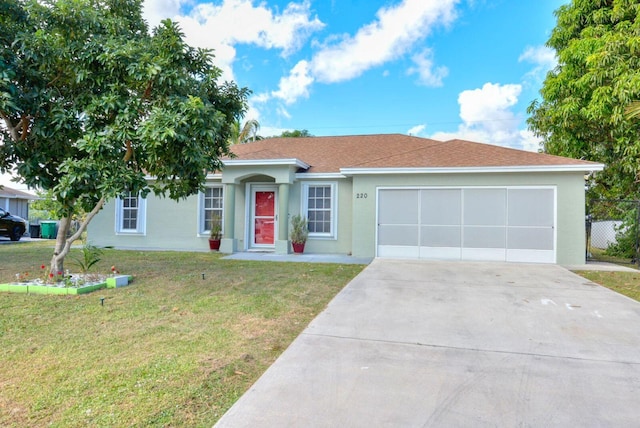 ranch-style home featuring a front yard, roof with shingles, driveway, an attached garage, and stucco siding